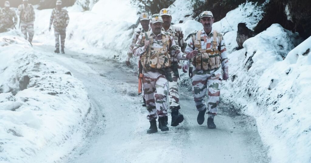 Indian Army soldiers in winter gear on snow-covered high-altitude terrain